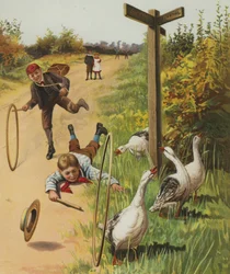 Jungen, die ihre Reifen zum Ziel rennen